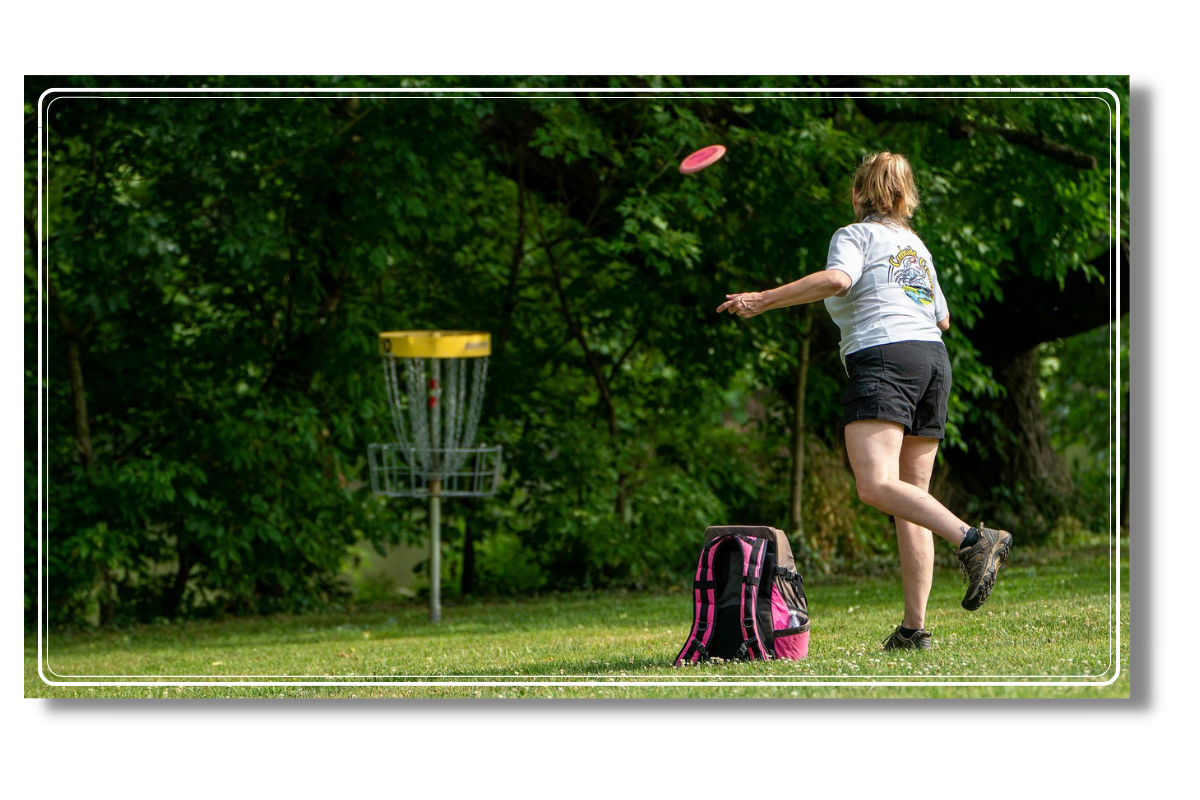 Woman playing disc golf